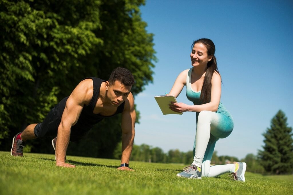 a trainer keeping an eye on her client