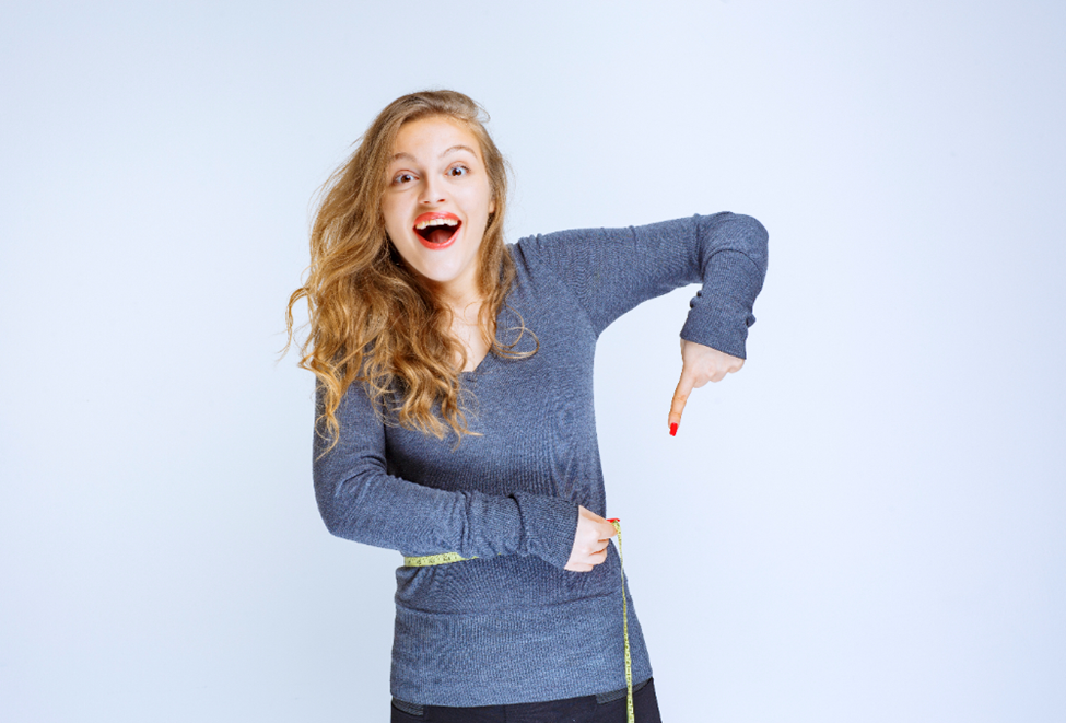 a woman pointing down with her thumb down